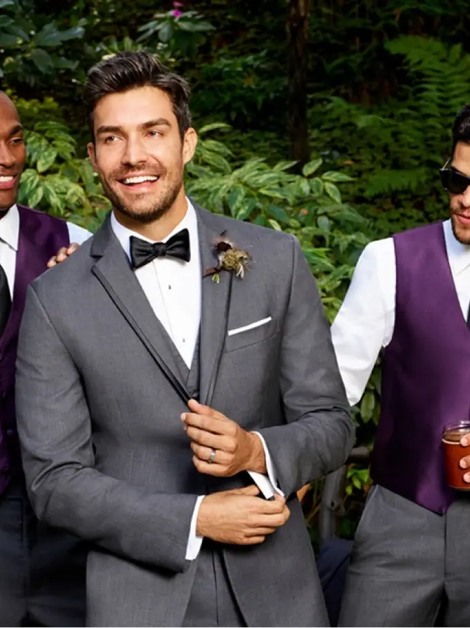 Men outdoors in suits smiling